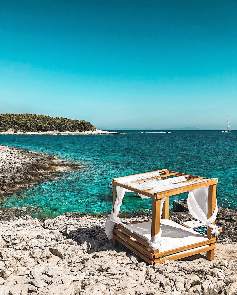 Idyllic cabana by turquoise waters in Split-Dalmatia, Croatia, perfect for relaxation.