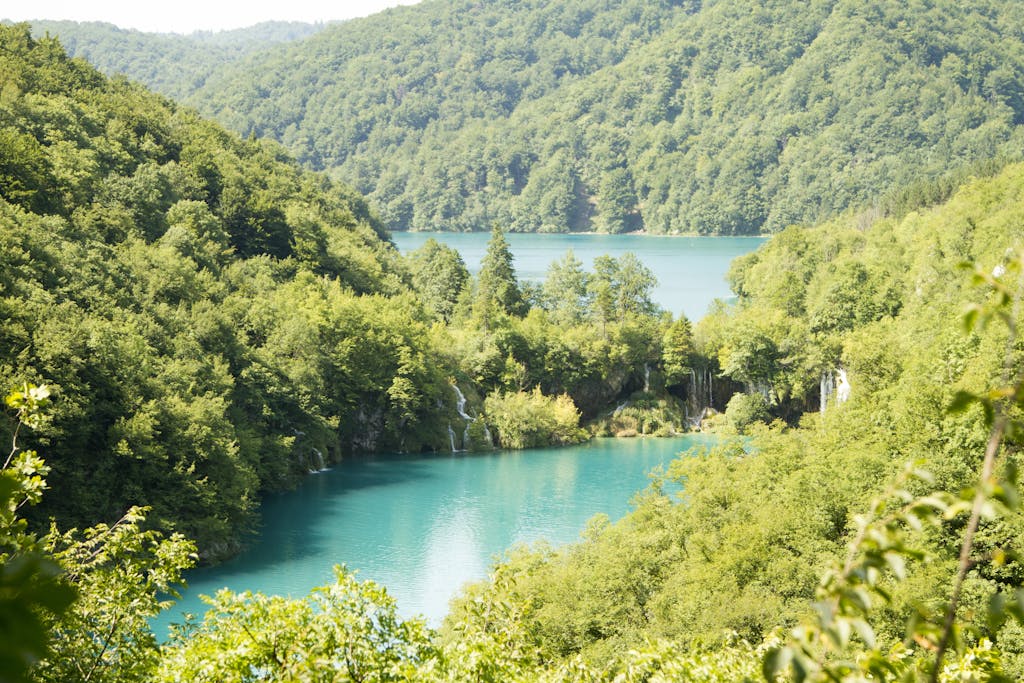 Breathtaking landscape of Plitvice Lakes with lush forests and turquoise waters.